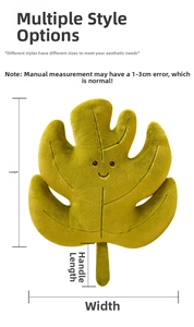 Detail view of cartoon leaf plush pillow with dimensions for width and height