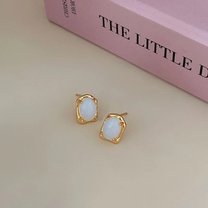 Elegant 925 sterling silver lava texture earrings with oval milky gemstone in gold finish