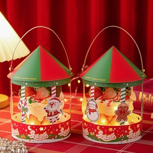 Close-up of Christmas carousel cupcake boxes with festive LED lights and decorations