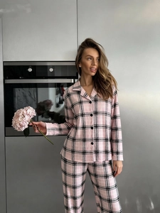 Close-up of pink and black plaid pajama set with classic lapel collar and buttons