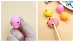 Macro view showing soft TPR material flexibility and cute animal squishy toy shapes