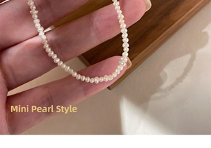 Close-up of mini freshwater pearl necklace showing detailed texture and small bead size