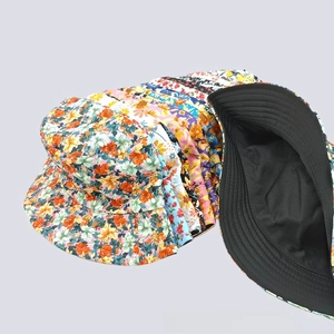 Detail view of assorted floral bucket hats with reinforced stitching and black lining