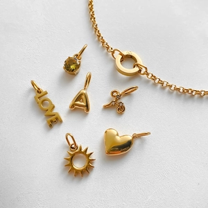 Elegant 14K gold plated stainless steel bracelet with love, heart and sun charms
