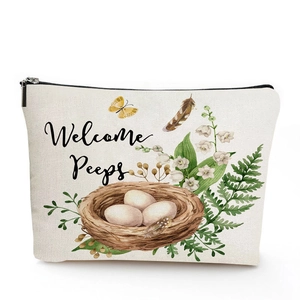 Detailed watercolor print of bird nest and eggs on linen toiletry travel bag