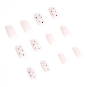 Short square matte nude pink press-on nails set with sparkling rhinestone accents