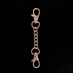 Macro shot of rose gold alloy keychain extension chain with double lobster clasps