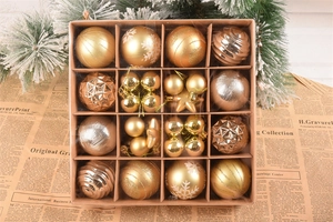 Detailed grid box showing mixed gold Christmas ornaments with matte and glitter finishes