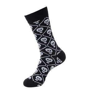 Detail of black crew socks featuring a white skull and crossbones diamond pattern