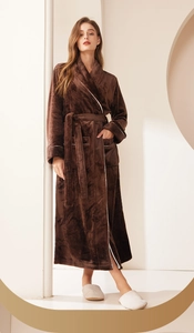 Close-up of thick coffee coral fleece robe featuring white contrast piping and soft texture