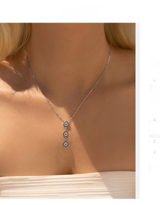Detailed view of S925 silver Y-necklace with blue teardrop stones and pavé crystals