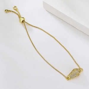 Detailed view of gold plated leopard head bracelet with sparkling cubic zirconia crystals