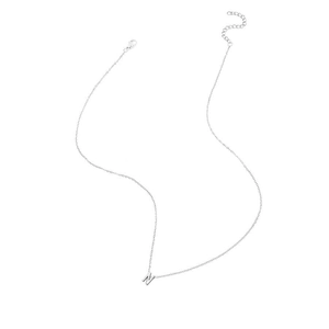 Detailed close-up of a silver initial N pendant with a delicate O-link chain necklace