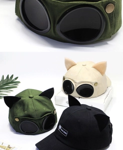 Detail of aviator pilot cap with cat ears and decorative goggles in multiple colors