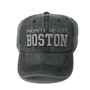 Macro detail of Boston embroidery on vintage washed cotton baseball cap fabric