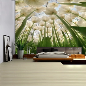 Detail of white tulip forest wall tapestry hanging as a modern bedroom headboard mural