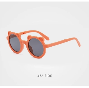 Detail shot of orange bear-eared folding sunglasses for kids at a 45-degree angle