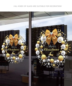 Detail showing golden reindeer and snowflake static window decals for Christmas decor