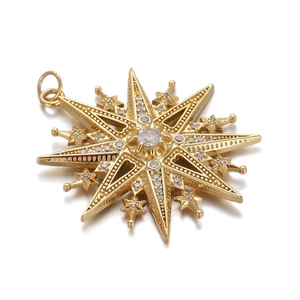 Macro view of gold star pendant with sparkling diamond inlay and polished surface