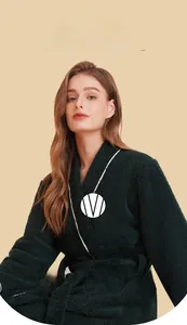 Detail of dark green plush bathrobe featuring a V-neckline and warm fleece fabric texture