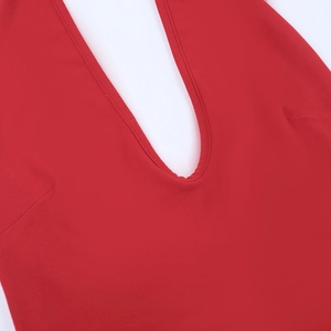 Close-up of red halter top neckline showing detailed stitching and fine knit fabric texture