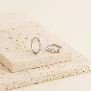 Detailed view of S925 sterling silver hoop earrings with elegant pearls and zircon stones