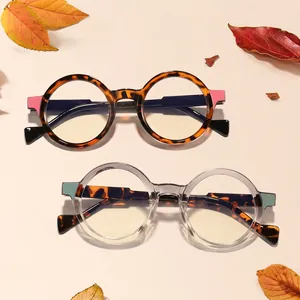 Retro round frame eyeglasses in tortoiseshell and clear finishes with colorful accents