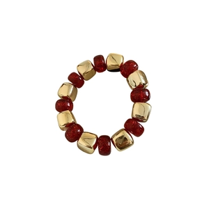 Elastic acrylic beaded bracelet with gold cubes and sparkling dark red translucent beads