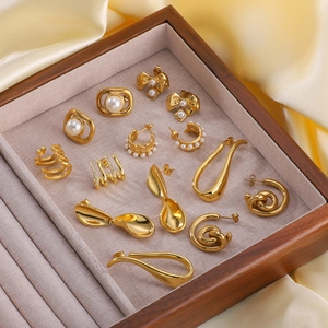 French vintage 18K gold plated titanium earrings set with pearls and crystals in a jewelry tray