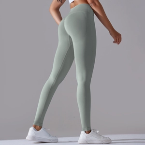 Detail view of seamless light olive yoga pants with scrunch butt lifting design