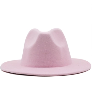 Detail of a minimalist pink wool felt fedora hat featuring a clean flat brim design