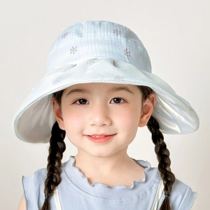 Detail of wide brim sun hat for girls with floral accents and wavy edge in light blue