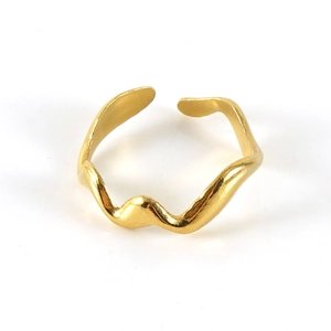 Detailed view of wave-shaped golden open ring with glossy metallic finish