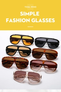 Close-up of oversize frames with T-shaped metal accents in various gradient lens colors