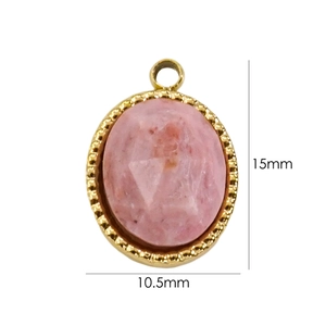 Detail view of a 15x10.5mm 14K gold plated oval pendant with pink natural stone