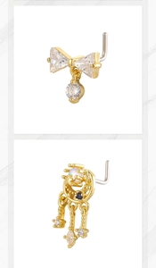 Close-up of golden L-shaped nose studs featuring bow pendant and star moon tassel with cubic zirconia