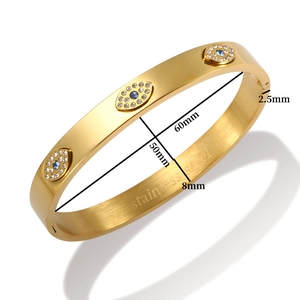Detailed view of evil eye stainless steel bangle with blue crystals and 8mm width