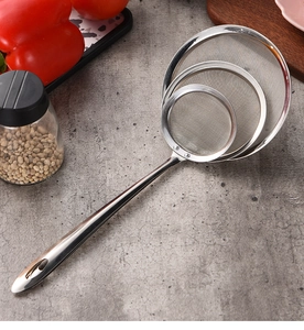 Three-piece stainless steel fine mesh strainer set with long handles on stone surface