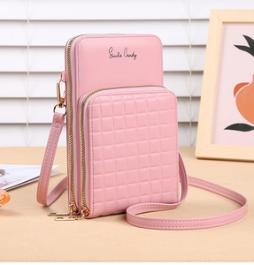 Detail of pink PU leather crossbody phone bag with quilted texture and gold zippers