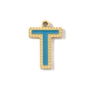 Detail of gold-plated letter T pendant with blue enamel filling and beaded edge decor