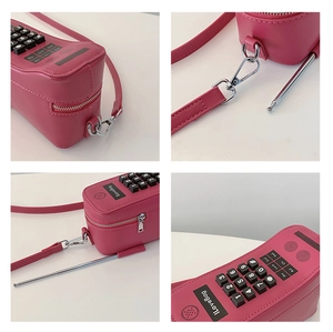 Macro detail of a vintage cellphone shaped crossbody bag with antenna and keypad