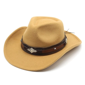 Close-up of a camel felt cowboy hat featuring a leather band with silver metal floral studs