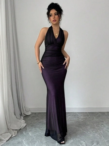Detail of deep purple halter dress featuring ruched chest design and slim fit mermaid silhouette