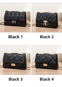 Detail view of four black quilted faux leather crossbody bags with metal chain straps