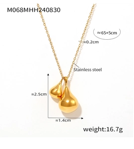 Detailed close-up of a gold double teardrop pendant necklace in polished stainless steel