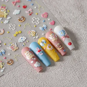 Detailed 3D embossed nail art stickers featuring bear, donut, and star patterns
