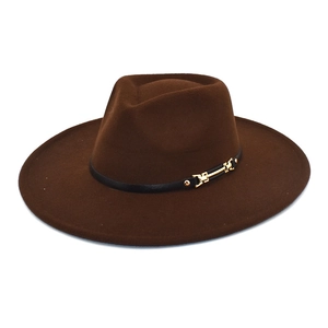 Detail of dark brown wool fedora hat featuring black leather band and gold metal buckle