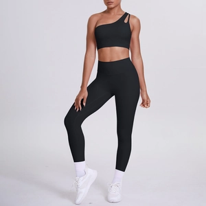Full view of black one-shoulder yoga set featuring cut-out sports bra and high-waist leggings