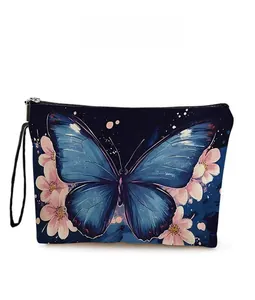 Detail of artistic butterfly and cherry blossom patterns on the portable cosmetic bag