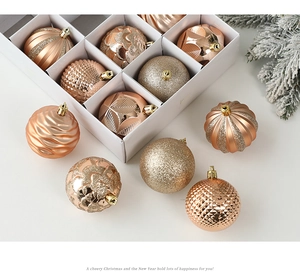 Close-up of 6cm champagne gold Christmas balls with various textures and matte finishes